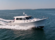 Starboard bow view of a 2016 Wesmac 42 cruising, with ocean and sky visible.