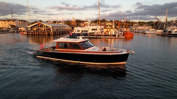 Boston Boatworks 48’ Daychaser in Harbor – East Coast Yacht Sales 2024 Boston Boatworks 48’ Daychaser slowly cruising through a harbor at golden hour.