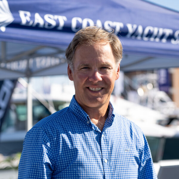 Headshot of Andrew Porter, Yacht Consultant based in Portsmouth, Rhode Island, taken at the Newport International Boat Show 2025 with the East Coast Yacht Sales tent in the background.