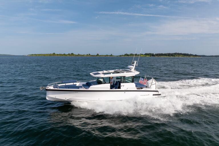 Axopar 29 XC Cross Cabin cruising in Casco Bay, Maine, photographed by East Coast Yacht Sales.