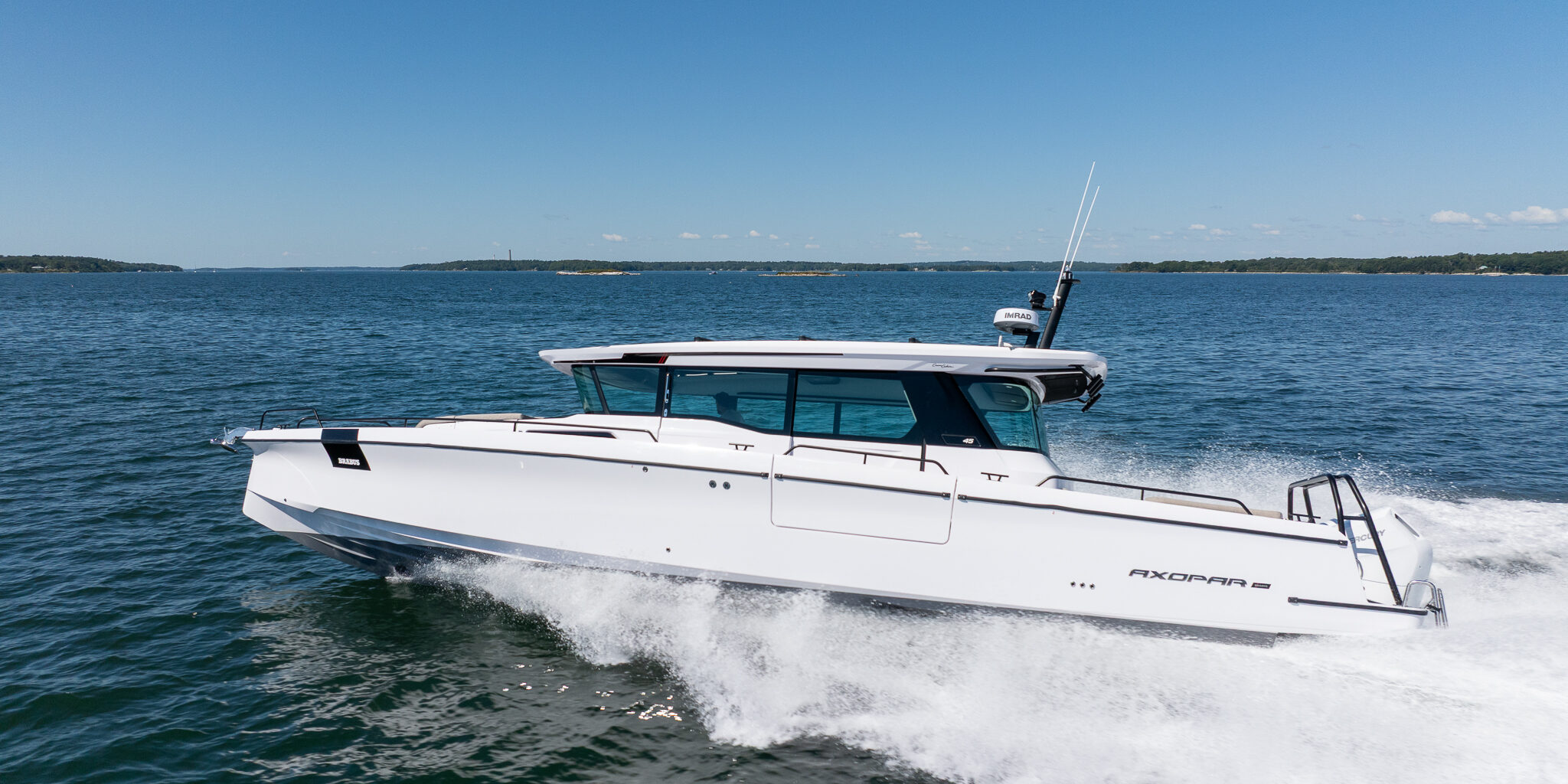 Axopar 45 BRABUS Edition Stock 2 Running Shot in Casco Bay, Maine Axopar 45 BRABUS Edition Cruising through Casco Bay, Maine on a sunny day