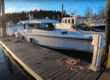 Axopar 37 docked in Northeast Harbor, Maine at sunrise on a calm March morning